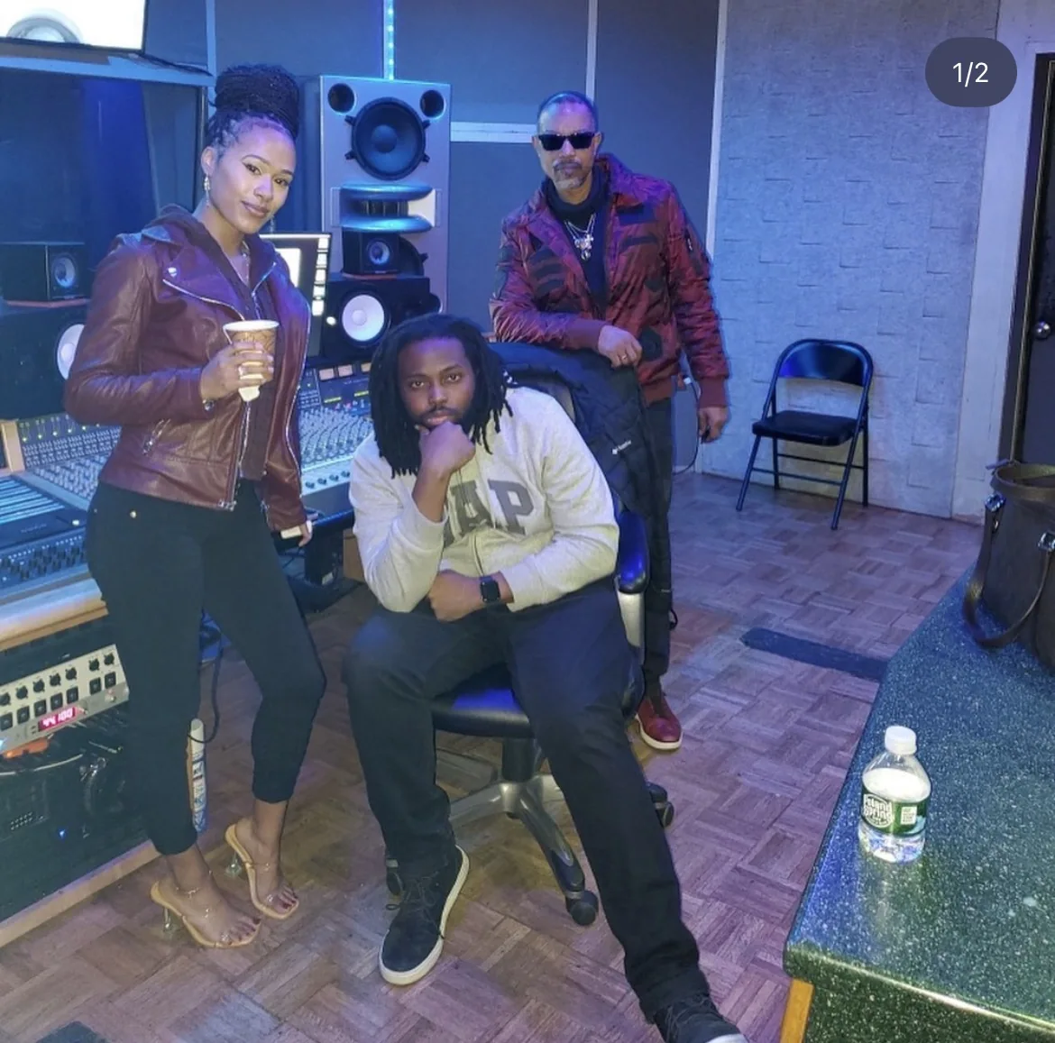 B’Chelle in a music studio with collaborators